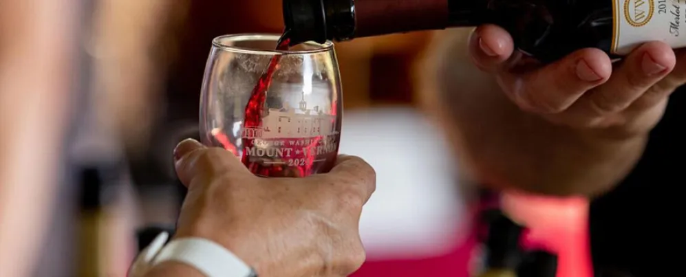 Wine pouring into glass at Mount Vernon Fall Wine Festival