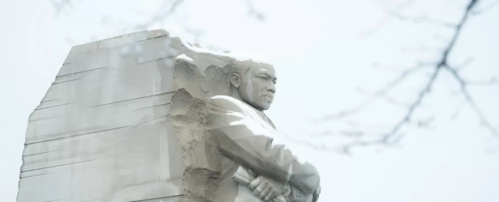 The Martin Luther King Jr. Memorial stands majestic with a light covering of snow in Washington, DC.