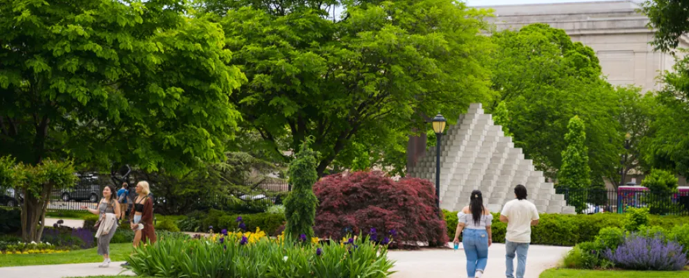People Walking Through The National Gallery of Art Sculpture Garden