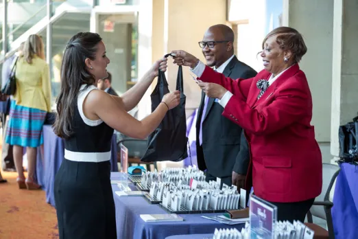 Destination DC Staffing Services redcoat assisting meeting attendee - Staffing solutions for events in Washington, DC