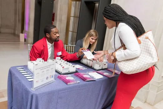 Destination DC staffing services redcoat providing assistance at registration to an event attendee in Washington, DC